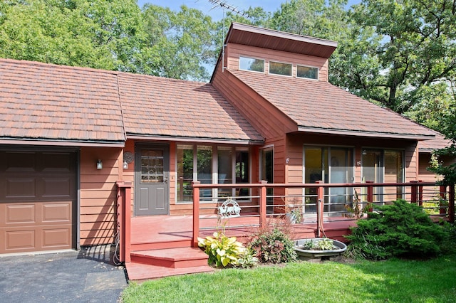 rustic home featuring an attached garage