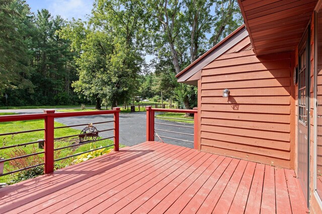 deck featuring a lawn