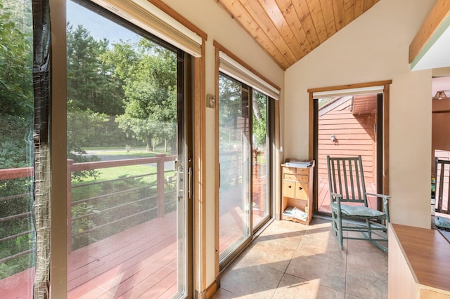 unfurnished sunroom featuring lofted ceiling and wooden ceiling