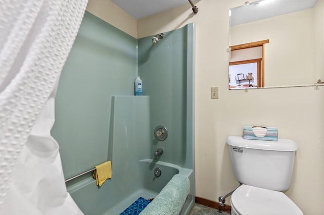 bathroom with a textured ceiling, shower / bathtub combination with curtain, and toilet