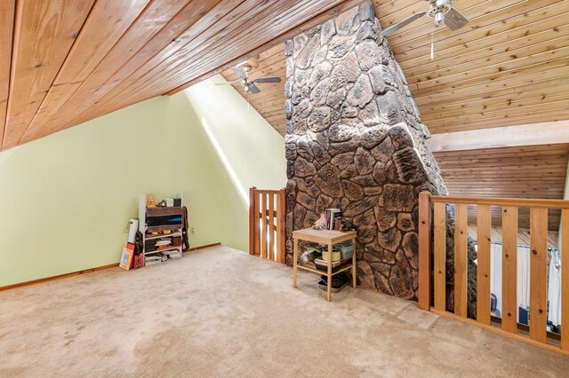 additional living space with carpet floors, wood ceiling, and ceiling fan