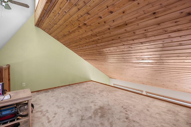 bonus room with carpet flooring, ceiling fan, wooden ceiling, and vaulted ceiling