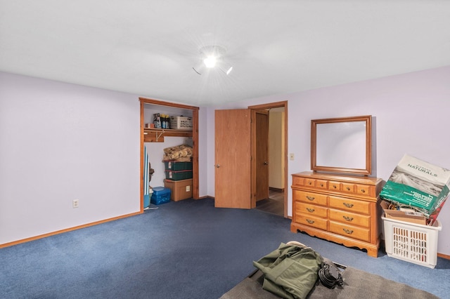 unfurnished bedroom featuring carpet floors and baseboards