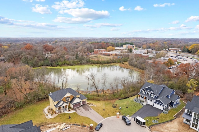 birds eye view of property with a water view