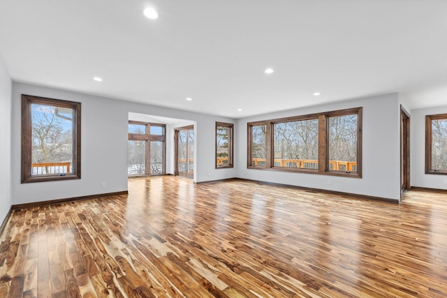 unfurnished living room with light hardwood / wood-style floors