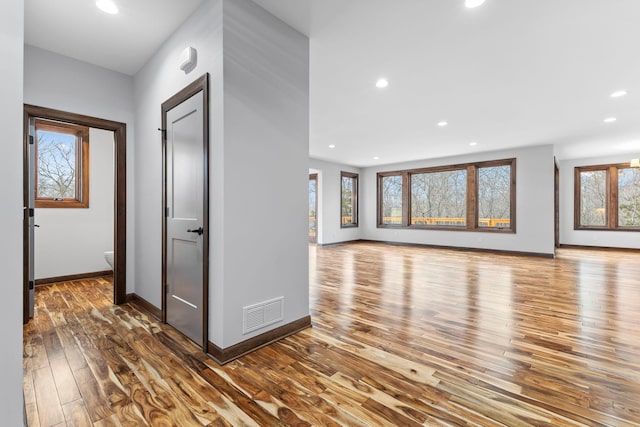 unfurnished living room featuring wood-type flooring