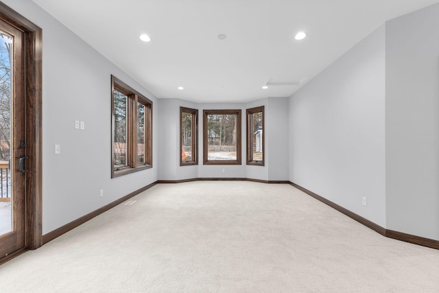 empty room featuring light carpet