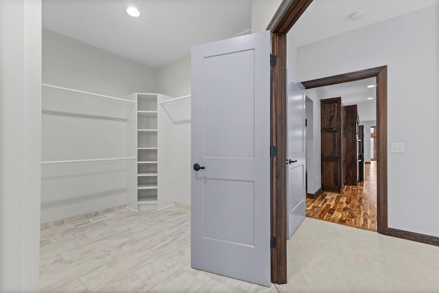 walk in closet featuring light hardwood / wood-style floors