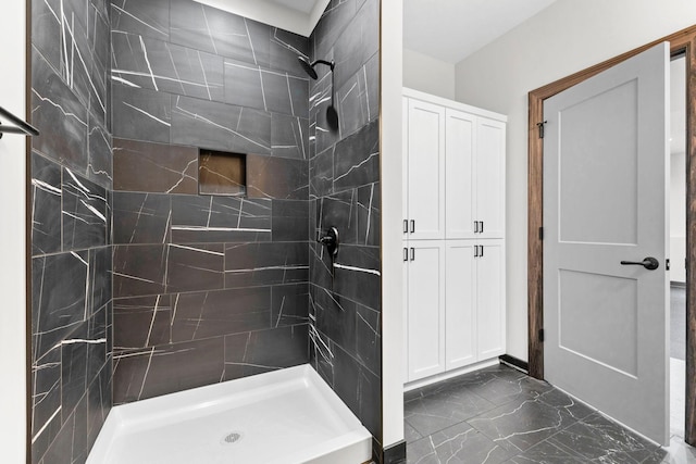 bathroom with tiled shower