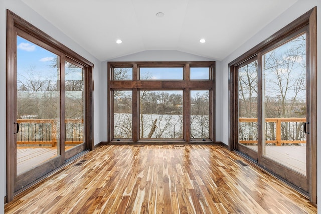 5534 Conifer Trl, Minnetonka, MN 55345 - unfurnished sunroom with vaulted ceiling, hardwood / wood-style floors, baseboards, a water view, and recessed lighting