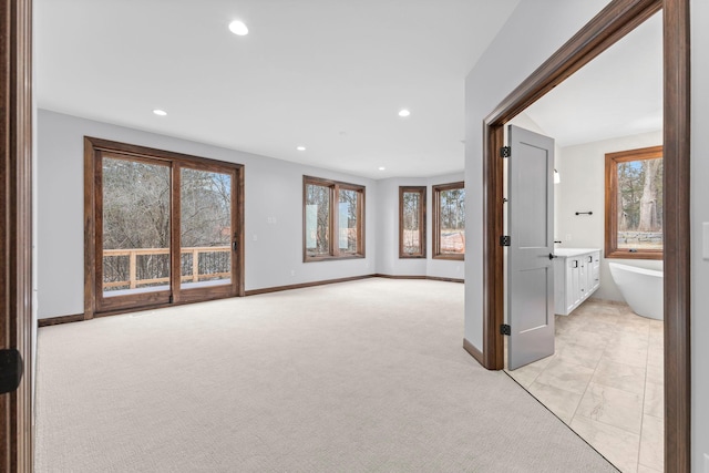 5534 Conifer Trl, Minnetonka, MN 55345 - unfurnished living room with recessed lighting, baseboards, and light colored carpet