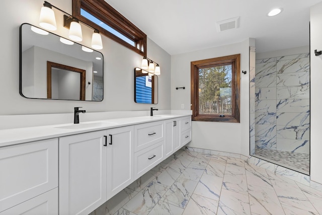 5534 Conifer Trl, Minnetonka, MN 55345 - full bath featuring marble finish flooring, double vanity, tiled shower, and recessed lighting