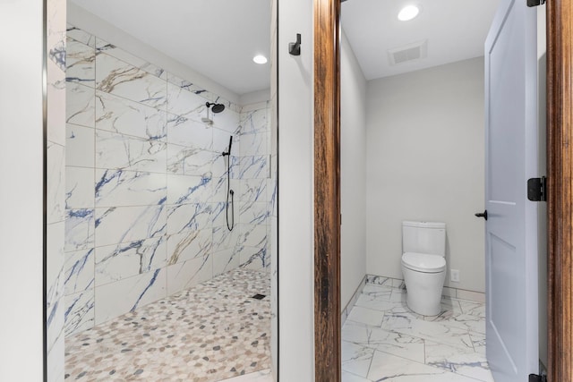 5534 Conifer Trl, Minnetonka, MN 55345 - bathroom with a tile shower, marble look tile flooring, toilet, and recessed lighting