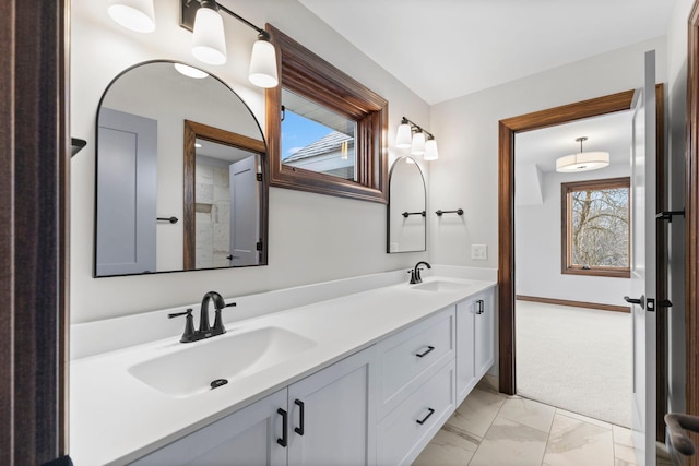 5534 Conifer Trl, Minnetonka, MN 55345 - bathroom featuring double vanity and marble finish flooring