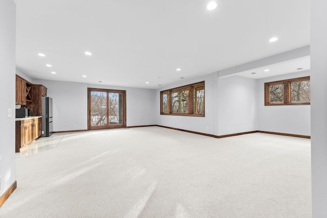 5534 Conifer Trl, Minnetonka, MN 55345 - unfurnished living room featuring light carpet, baseboards, and recessed lighting