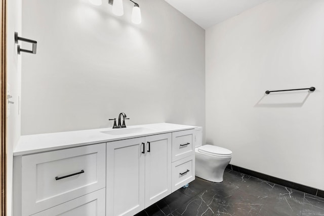 5534 Conifer Trl, Minnetonka, MN 55345 - bathroom featuring toilet, vanity, baseboards, and marble finish flooring