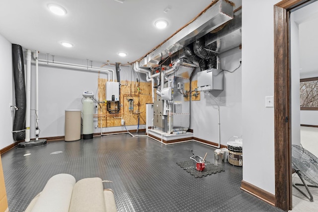 5534 Conifer Trl, Minnetonka, MN 55345 - finished basement featuring baseboards, rubber floors, a water softener system, water heater, and recessed lighting