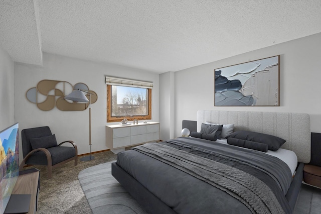 bedroom featuring a textured ceiling and carpet floors