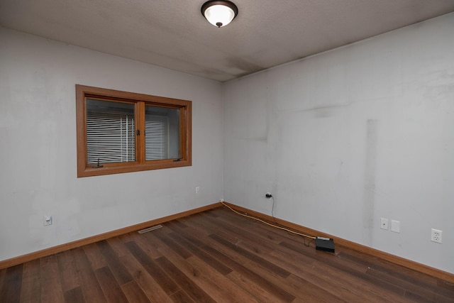 unfurnished room with hardwood / wood-style floors