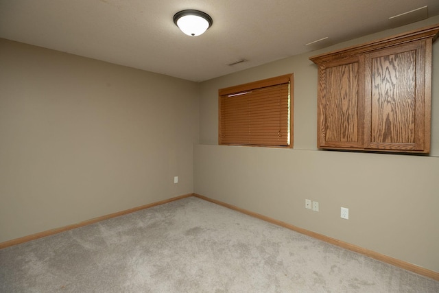 unfurnished room featuring carpet flooring