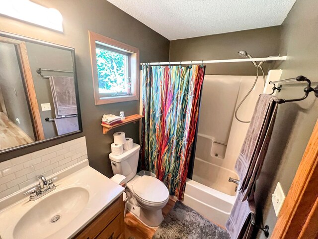 full bathroom with vanity, shower / bathtub combination with curtain, tasteful backsplash, a textured ceiling, and toilet