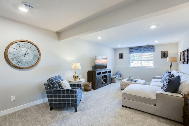 living room with beam ceiling and carpet