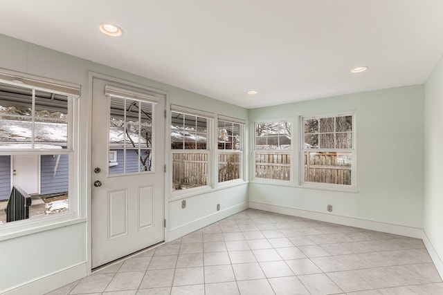 unfurnished sunroom with plenty of natural light