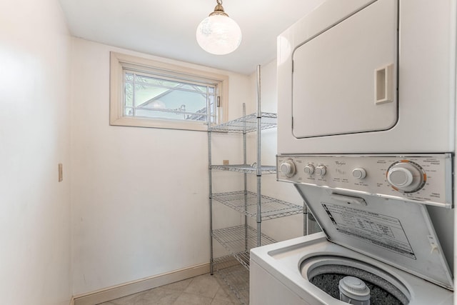 laundry area featuring stacked washer / dryer