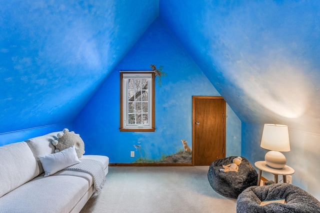 sitting room featuring lofted ceiling and carpet