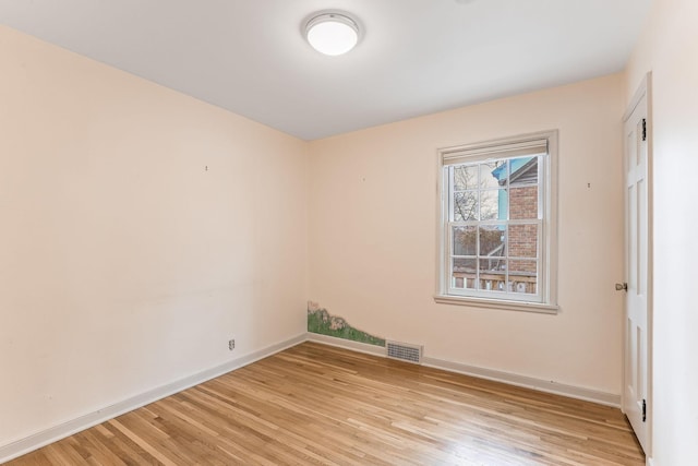 spare room featuring light hardwood / wood-style flooring