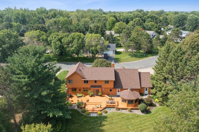 aerial view featuring a view of trees