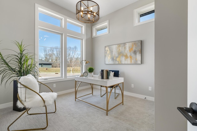 carpeted office space with an inviting chandelier