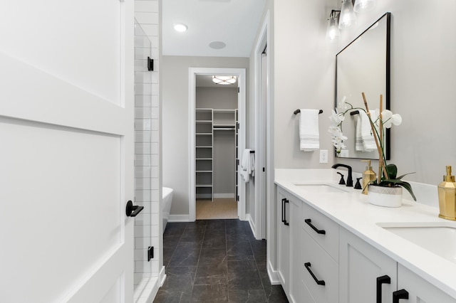 bathroom featuring vanity, walk in shower, and tile patterned flooring