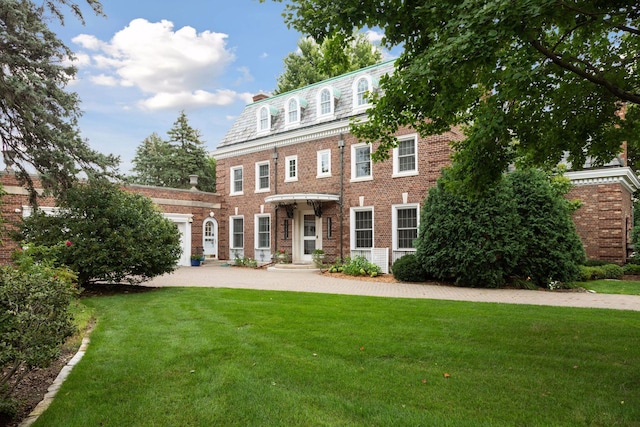 back of house with a lawn