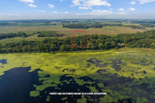 birds eye view of property with a water view and a rural view