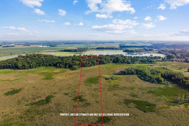 drone / aerial view featuring a water view and a rural view