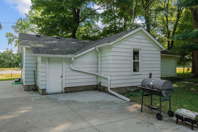 rear view of property featuring a patio area