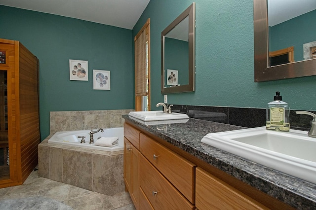 full bathroom with a sink, a garden tub, and double vanity