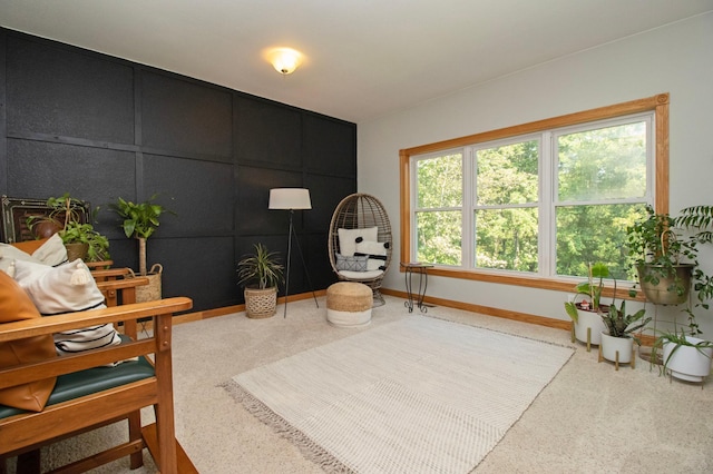 living area featuring baseboards
