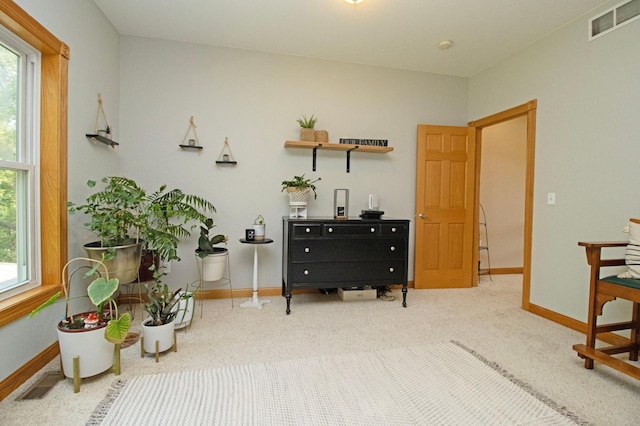 sitting room with baseboards, carpet, and visible vents