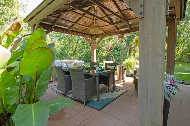 view of patio with a gazebo and outdoor dining area