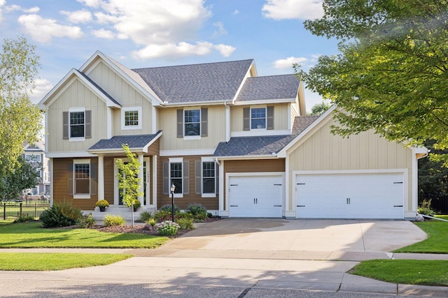 craftsman-style house with a garage and a front lawn