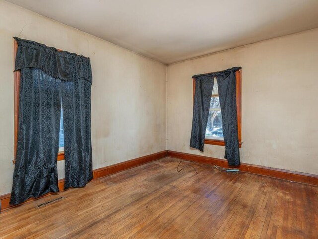 empty room featuring hardwood / wood-style flooring