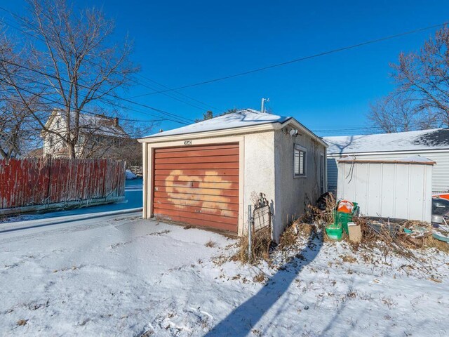 view of snow covered garage