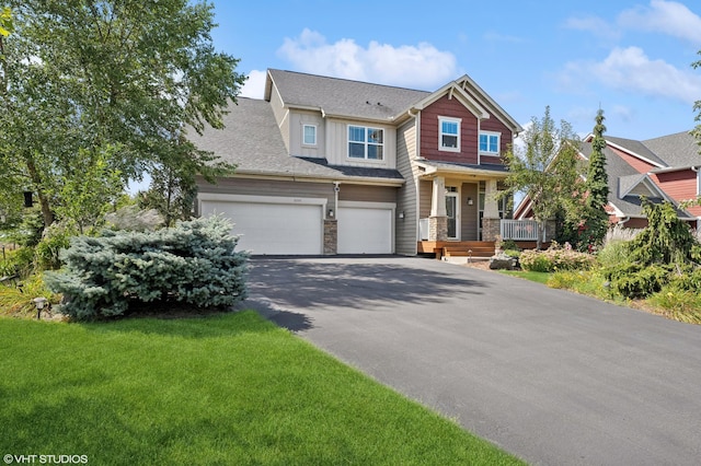 view of front facade featuring aphalt driveway, a garage, stone siding, roof with shingles, and a front lawn