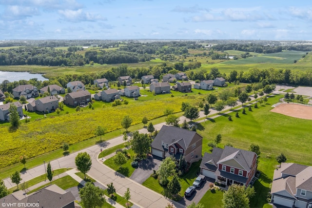 bird's eye view featuring a residential view and a water view