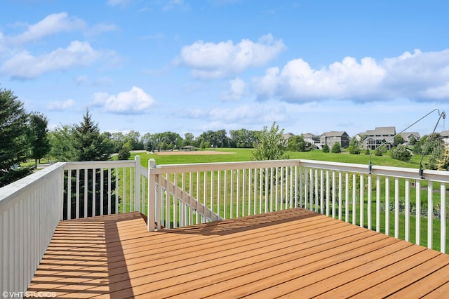 wooden deck featuring a yard