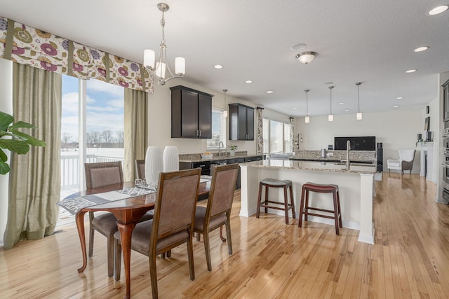 dining room featuring light wood-style floors and recessed lighting