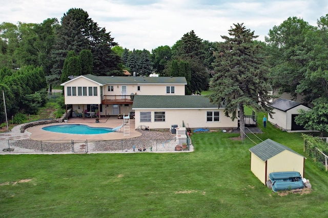 10873 69th Ave N, Maple Grove, MN 55369 - rear view of property featuring a patio area, a yard, a sunroom, an outdoor pool, and a storage unit