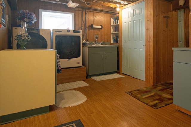 10873 69th Ave N, Maple Grove, MN 55369 - laundry room with independent washer and dryer, wood finished floors, cabinet space, and wooden walls